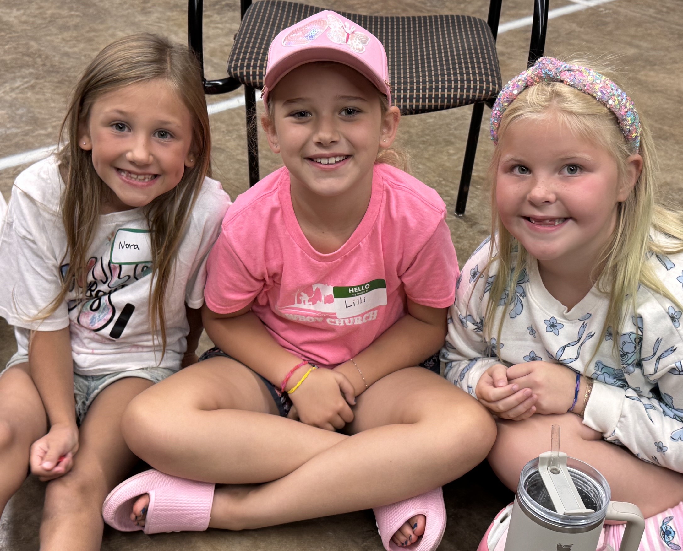Kids gathered on steps during Cowboy Church ministry